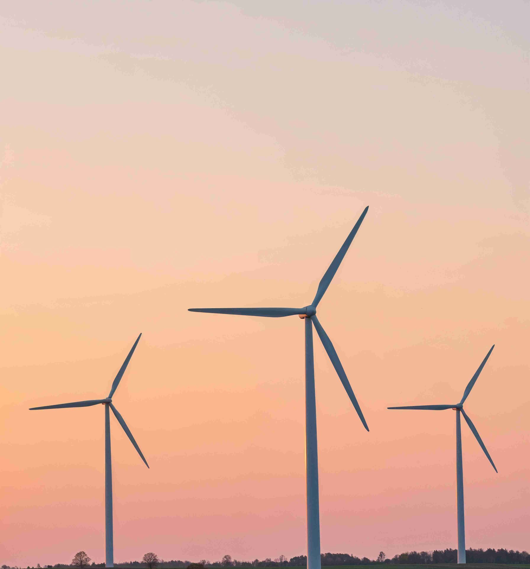 wind turbines against vibrant sunset sky_11zon scaled e1753938224728